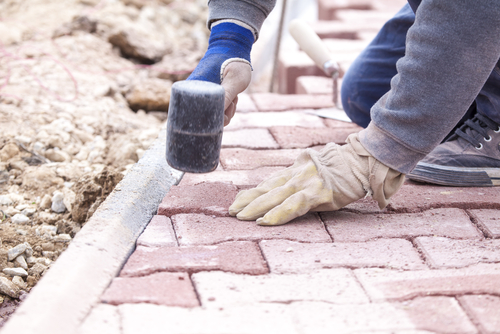 Lee County paver contractor installing a residential driveway using pavers